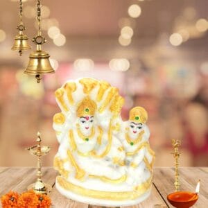 "3-inch polyresin Vishnu Lakshmi idol sitting on Sheshnag, featuring Lord Narayan and Goddess Lakshmi with a smooth marble texture, ideal for home puja room