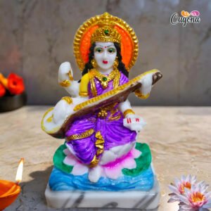 "Cugona Saraswati Idol - 13 cm tall, made from high-quality polyresin with intricate handwork, representing Maa Saraswati, the Hindu goddess of wisdom, music, and arts.